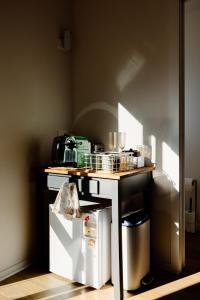 a kitchen with a counter and a table with a food at The Albert Studio in Albert Town