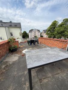 a picnic table on top of a brick wall at Cozy Room for 2 people in Dresden
