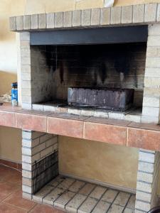 a brick fireplace with a brick at Двоповерхові апартаменти в яхт-клубі in Odesa