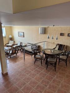 a group of chairs and tables in a room at Двоповерхові апартаменти в яхт-клубі in Odesa +4 photos