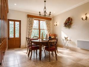 a dining room with a table and chairs at Twelve on Albert in Beechworth