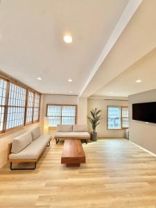 a large living room with a couch and a table at Central Roppongi House in Tokyo