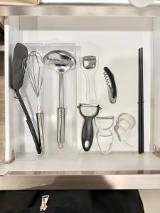 a drawer filled with kitchen utensils at Central Roppongi House in Tokyo
