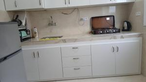 a kitchen with a counter top with a microwave and a microwave at Acacia Nest in Tangier
