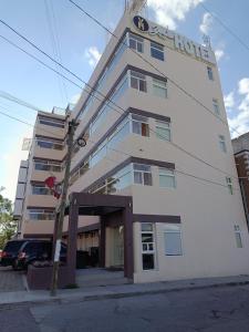 a tall white building with a hotel sign on it at Hotel Yahalis in Jilotepec de Abasolo