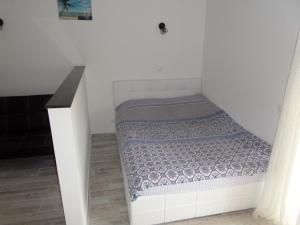 Postel nebo postele na pokoji v ubytování Estudio Clube dos Arcos
