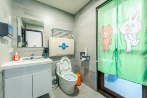 a bathroom with a sink and a toilet and a shower at 日曜居Nichiyō inn in Dayuan +42 photos
