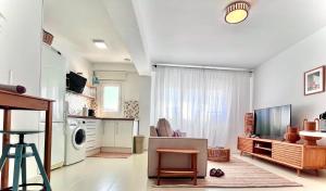 a large living room with a washer and dryer at casArena 1 in Las Negras