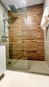 a shower with a glass door in a bathroom at casArena 1 in Las Negras +19 photos