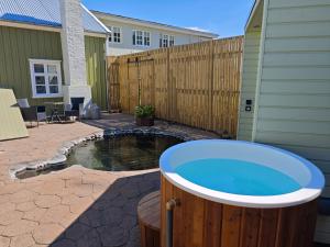 a hot tub in the backyard of a house at Hótel Tindastóll in Sauðárkrókur