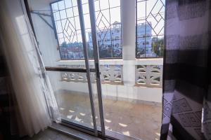a view of a balcony from an open window at Talia holiday home ,Malindi kenya -1 in Malindi