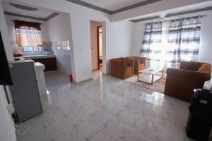 a living room with two couches and a table at Talia holiday home ,Malindi kenya -1 in Malindi