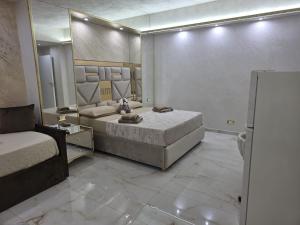 a bedroom with a bed and a large mirror at B&B la marica in Adrano +256 photos