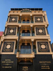 a tall building with balconies on top of it at Hotel New Lucknow in Lucknow