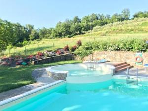 a swimming pool in a yard with a swimming pool at Agriturismo Podere La Casaccia in Poppi +17 photos