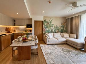 a living room with a couch and a table at Laguna Seaside 3 bed #84195 in Bang Tao Beach
