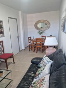 a living room with a couch and a table at Casa rias baixas in Poio