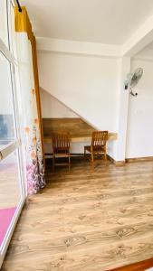 a living room with two chairs and a staircase at 97 Ella in Ella +24 photos