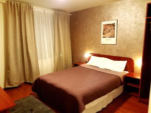 מיטה או מיטות בחדר ב-Hotel Mic