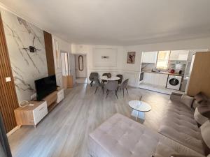 a living room with a couch and a table at Complex Sands Holiday Apartments in Sunny Beach