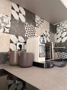 a kitchen with a coffee maker on a counter at Luxury Apartment Vorstetten Modern Zentral in Vörstetten