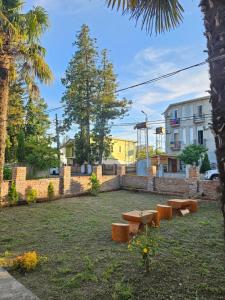 a group of picnic tables in a park at Guesthouse Las Palmas in Ureki