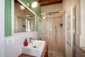 a bathroom with a sink and a shower at Agriturismo Marinello in Pienza +103 photos