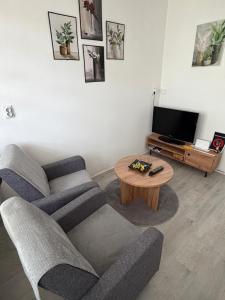 a living room with a couch and a coffee table at Apartman Velić in Bor