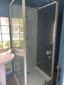 a bathroom with a shower and a sink at L'Escapade in Gonneville-la-Mallet +7 photos