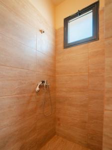 a bathroom with a shower with a window at Zuma Hotel Cyprus - Turkish Side in Nicosia +42 photos