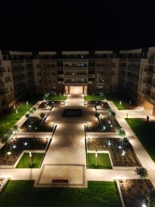 an empty courtyard in a building at night at Di Trevi Apartment in Wrocław