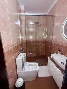 a bathroom with a toilet and a shower and a sink at AL Hotel in Vlorë +51 photos