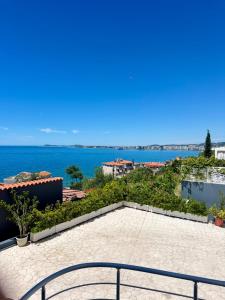 a view of the ocean from the balcony of a house at AL Hotel in Vlorë