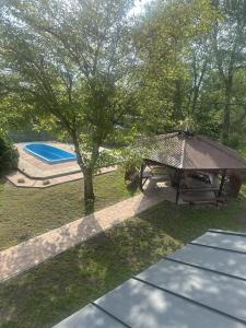 an overhead view of a picnic table and a tree at Maziarówka in Basznia Dolna