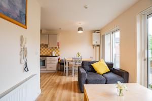 a living room with a couch and a table at Spacious Group Base - 4 Bed Central Limerick in Limerick