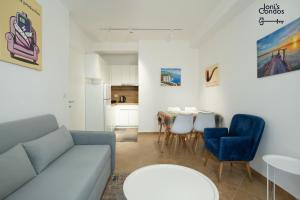 a living room with a couch and a table at Joni's Condo 10 in Golem
