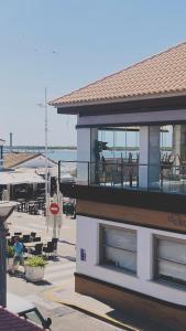 a building with a balcony with a view of the ocean at Casa Cañailla in El Rompido