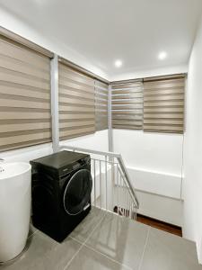 a laundry room with a washer and dryer at Sky villas with large balcony in Hanoi +107 photos