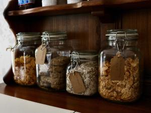 a group of jars of nuts on a shelf at The Florence Guest House in Whitby