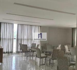 a dining room with chairs and a table in a building at Apartamento de 3 quartos, climatizado com lazer completo in Brasília +155 photos