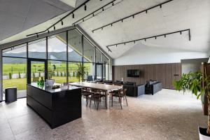 a large room with a table and chairs at Chalet Rila in Govedartsi