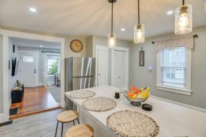 a kitchen with a counter top and a refrigerator at Charming Condo near Gillette Stadium in Sharon