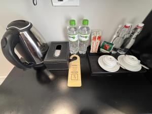 a black tray with bottles of water on a table at Classy Central Hotel in Hanoi