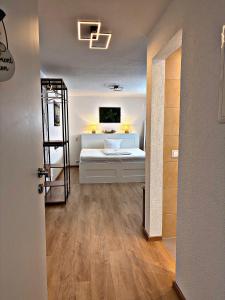 a room with a bed and a ladder in it at *moderne Wohnung ANTON in VS mit Küche+Bad in Villingen-Schwenningen