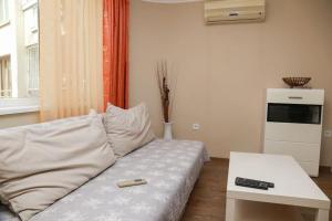 a living room with a couch and a table at Top Centre, Quiet, Independant in Burgas