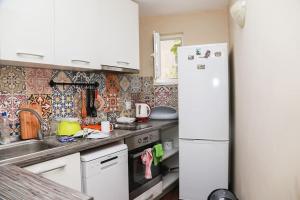 a kitchen with white appliances and a white refrigerator at Top Centre, Quiet, Independant in Burgas