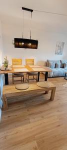 a dining room with a table and a couch at Stilvolle Wohnung in Waldbrunn in Waldbrunn