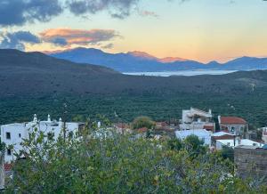 a view of a city with mountains in the background at Almyra Summer Homes in Ierapetra