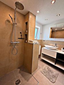 a bathroom with a shower and a sink at *moderne Wohnung ANTON in VS mit Küche+Bad in Villingen-Schwenningen +16 photos