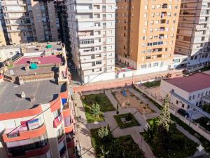 an aerial view of a city with tall buildings at appartement chaleureux in Oran